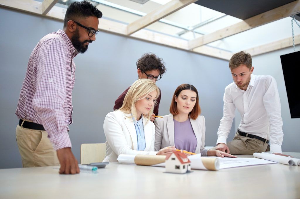 business team discussing house project at office